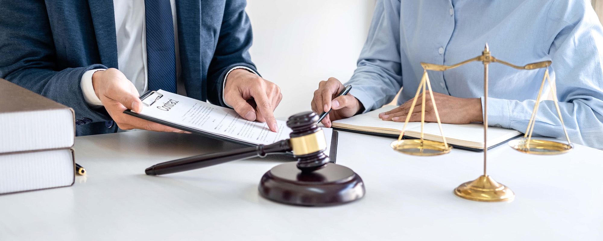 Male lawyer and professional business woman working and discussion having at law firm in office