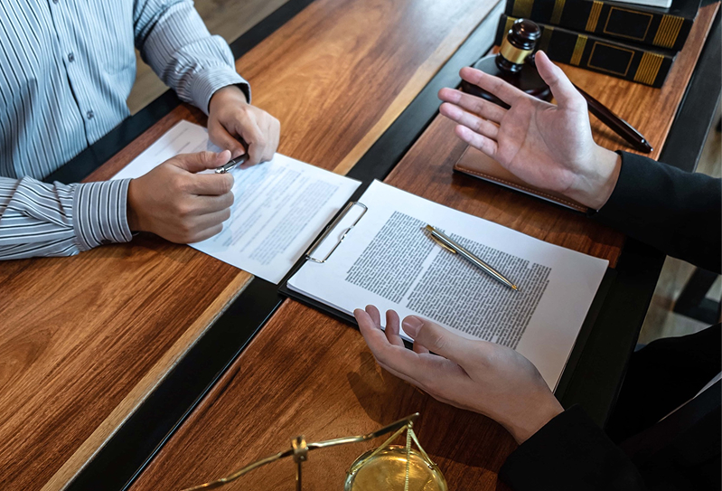 Male lawyer discussing legal case with client