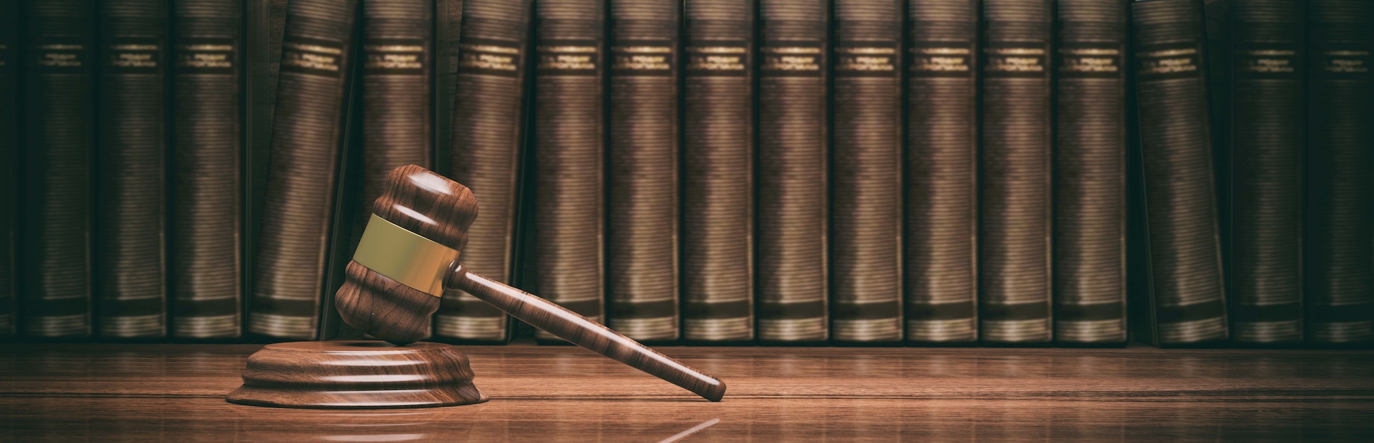 Wooden judge gavel and law books. 3d illustration