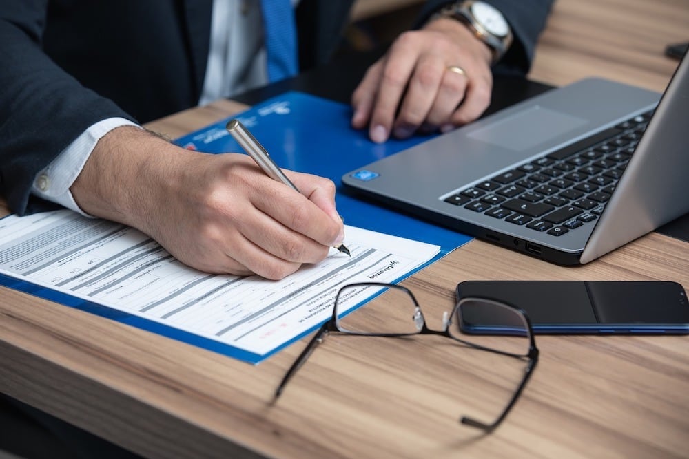 business man signing document